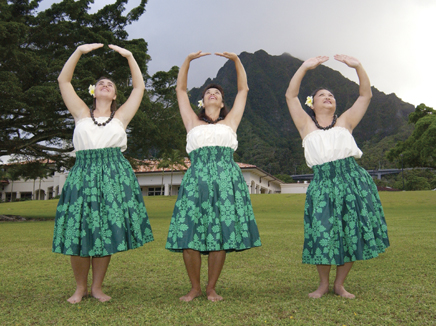 UH Windward Community College hula halau / three hula dancers outdoors