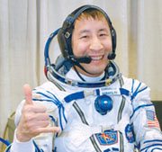 Astronaut Ed Lu flashes the shaka sign