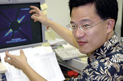 Astroner Mike Liu points to an image on his computer