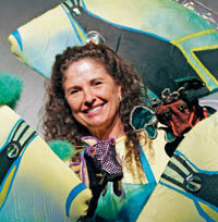 theatre expert Tamara Montgomery surrounded by colorful props