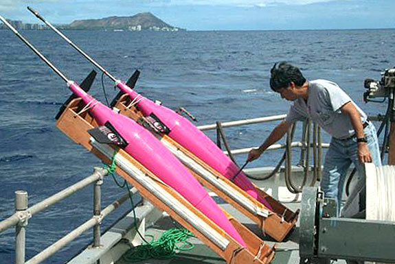 sea glider on a boat with Diamond Head in the background