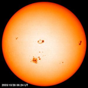 The sun's disk showing active region 10486, which became the largest sunspot seen by SOHO.