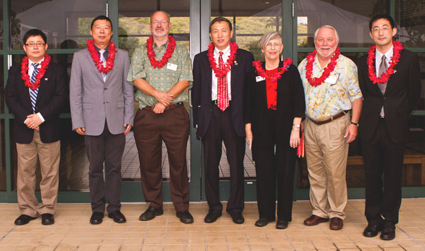 group of people wearing red lei