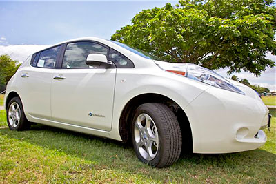 A white Nissan Leaf electric vehicle