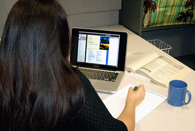 A student in front of a laptop