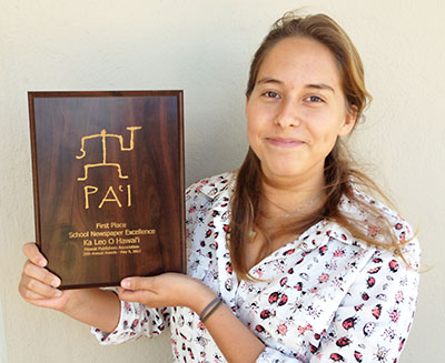 woman holding award