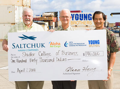 men holding a large check