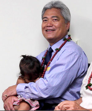 man holding granddaughter
