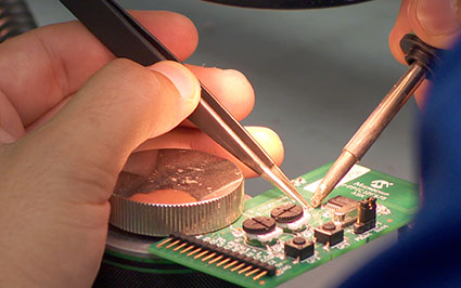 close up of engineer working on circuit board