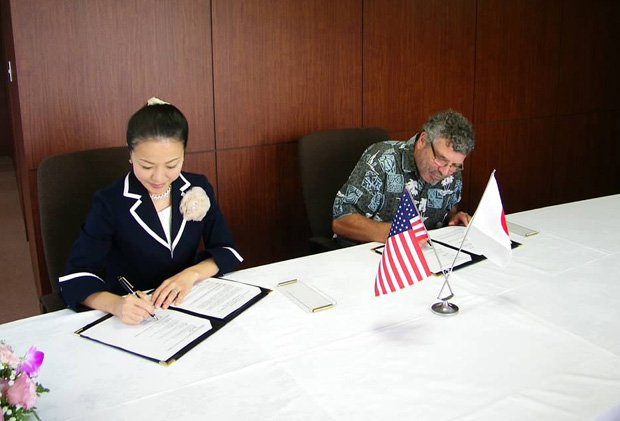 two people signing agreement