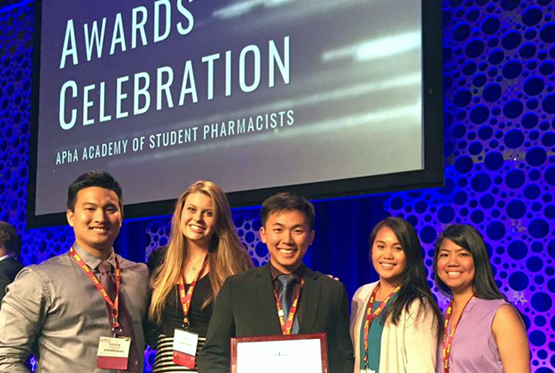 Pharmacy students accepting award