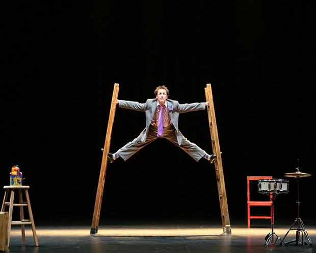 actor performing on ladder 