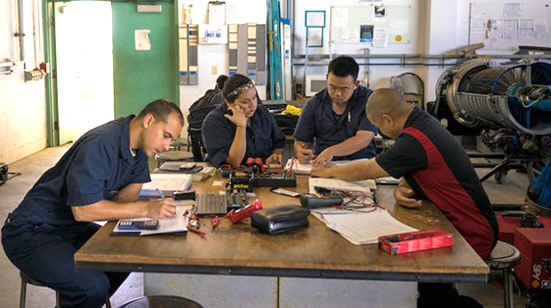 aeronautics maintenance students sitting at a table