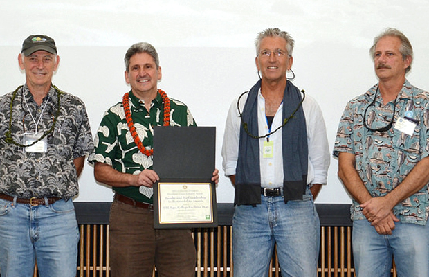 four people with sustainability award