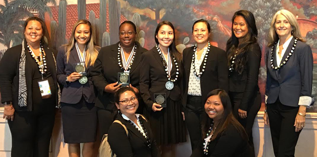 group of smiling women in professional attire