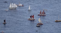 Hokulea and other boats and ships in the water