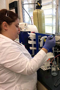 Sasha Canovali doing an experiment in a laboratory