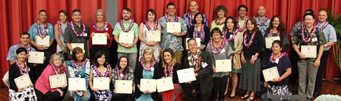large group of people holding certificates