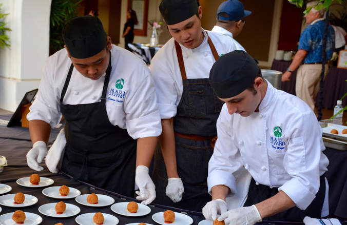 Student participants carefully plating food