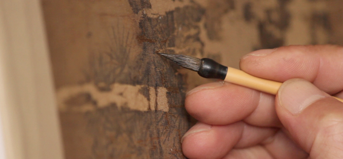 hands holding art-painting brush