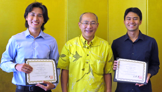 Yasushi Misawa presenting DeLang and Yasumori with certificates