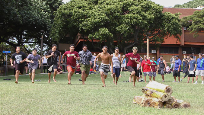 Young men participating in Makahiki games