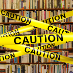 caution tape on bookshelves