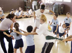 children and adults dancing in a circle
