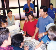 group of children listening to one adult