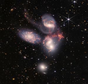 Stephan’s Quintet. The four galaxies in a vertical line at 270 million light years. Credit: NASA