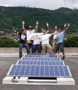 Sustainable Saunders students with solar panels