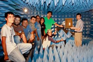 Professor Yun [on right] and HCAC faculty and students in the indoor antenna anechoic chamber  