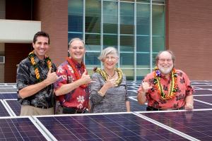 L-R: Scott Paul, Gregg Geary, Virginia Hinshaw and Governor Abercrombie in front of the PV system.