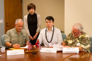 Chancellor Tom Apple, CSCEC General Manager Fuchun Sun, and Dean Clark Llewellyn sign the MOU.
