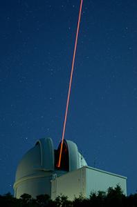 The ultraviolet Robo-AO laser originating from the Palomar 1.5-meter Telescope dome. 