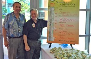 Fund drive co-chair Larry Burgess, MD, with Dean Jerris Hedges (right) at the popcorn celebration.