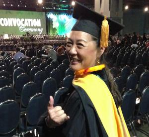 Dr. Marjorie Mau flashes a shaka sign, before the Mastership Ceremony in Washington D.C.