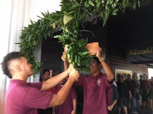 Senior students cut the ceremonial “lei piko” symbolizing the start of a new school year.