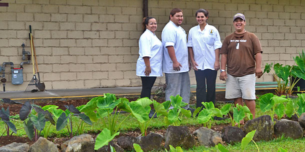 A group of culinary students in a garden