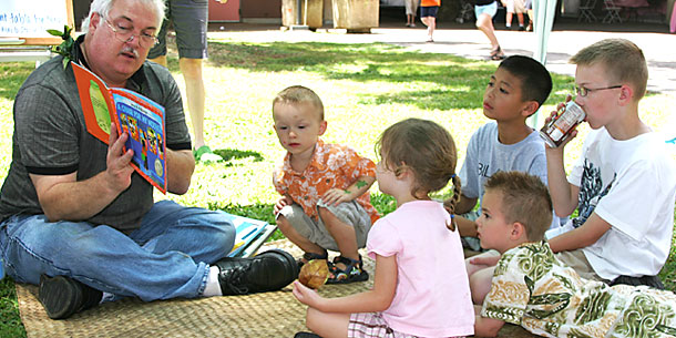 person reading to children