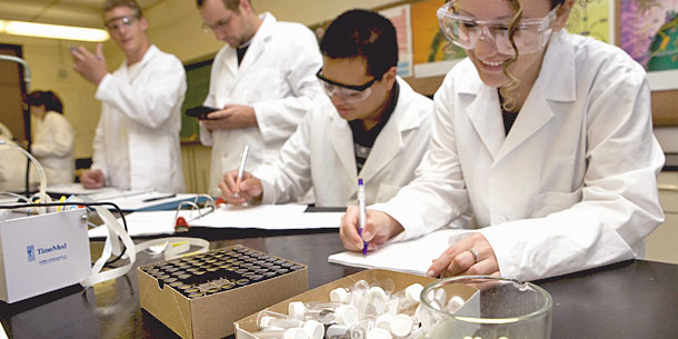 Four pharmacy students in a lab