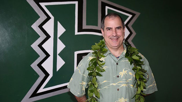 David Matlin in front of the H logo