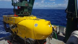 yellow sub on the deck of a vessel