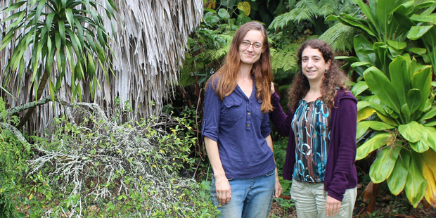 Norton and Ostertag standing in front of foliage