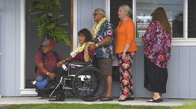 Luana Dang and family in front of their home