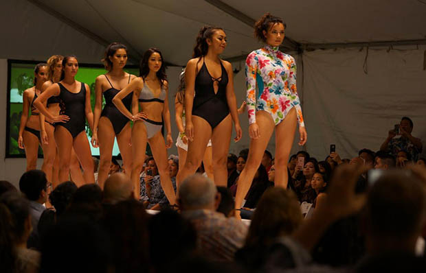 Models in swimsuits on the runway