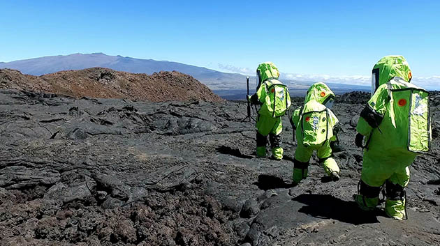 HI-SEAS participants in space suits on Mauna Loa