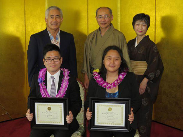 Junichi Yagi seated next to Jennifer Yoo