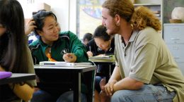 teacher and student in a classroom