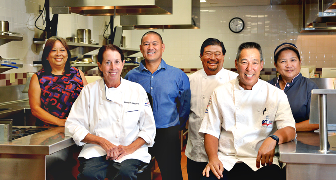 6 people in a professional kitchen